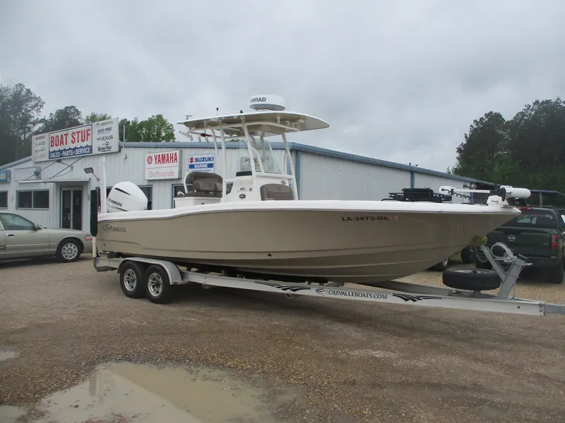 Slide: The Image of 2020 Crevalle 26 HCO boat on trailer outside dealership, overcast day. - 0