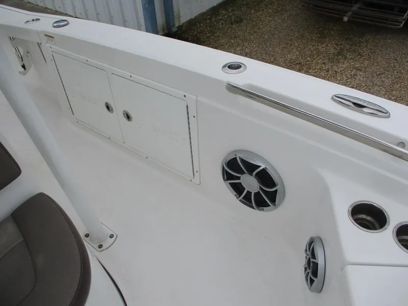 Slide: The Image of 2020 Crevalle 26 HCO boat interior with storage compartments and speakers. - 15