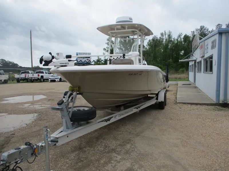 Slide: The Image of 2020 Crevalle 26 HCO boat on trailer in outdoor setting. - 2