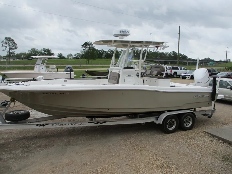 Slide: The Image of 2020 Crevalle 26 HCO boat on trailer, parked outdoors, overcast sky. - 4