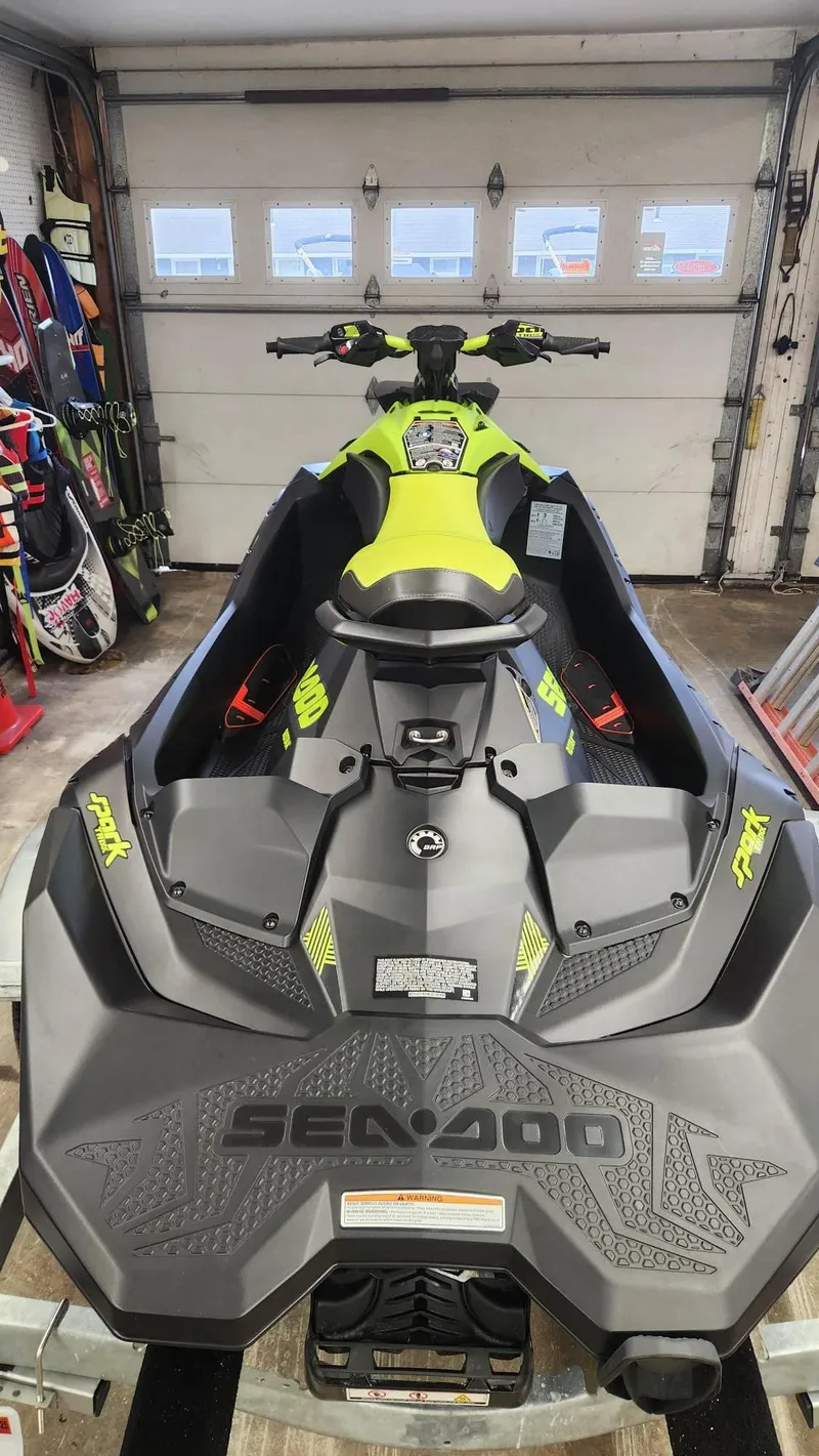 Slide: The Image of 2023 Sea-Doo SPARK 3UP TRIXX SS in a garage, showcasing sleek design and vibrant colors. - 4