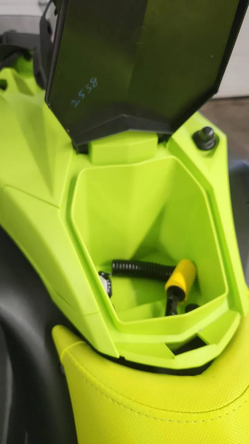 Slide: The Image of 2023 Sea-Doo SPARK 3UP TRIXX SS storage compartment with accessories, lime green interior. - 6