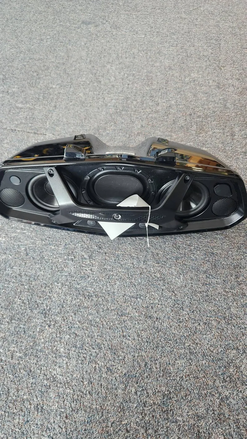 Slide: The Image of 2023 Sea-Doo SPARK 3UP TRIXX SS audio system on carpeted floor. - 9