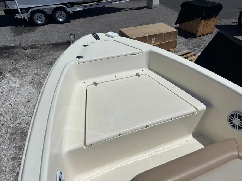Slide: The Image of 2022 Scout 175 Sportfish boat deck with storage compartments and seating. - 17