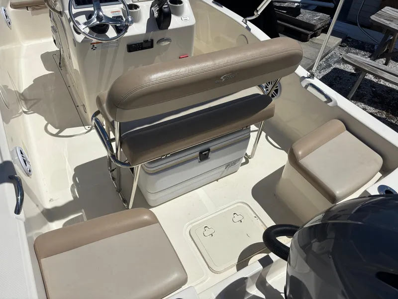 Slide: The Image of 2022 Scout 175 Sportfish boat interior with seating and steering console. - 5
