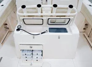 Slide: The Image of 2025 Grady-White Canyon 271 boat dashboard with steering wheel and controls. - 5