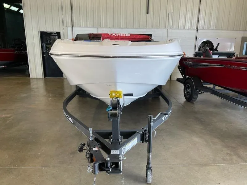 Slide: The Image of 2024 Tahoe T18 boat on trailer in indoor storage facility. - 2