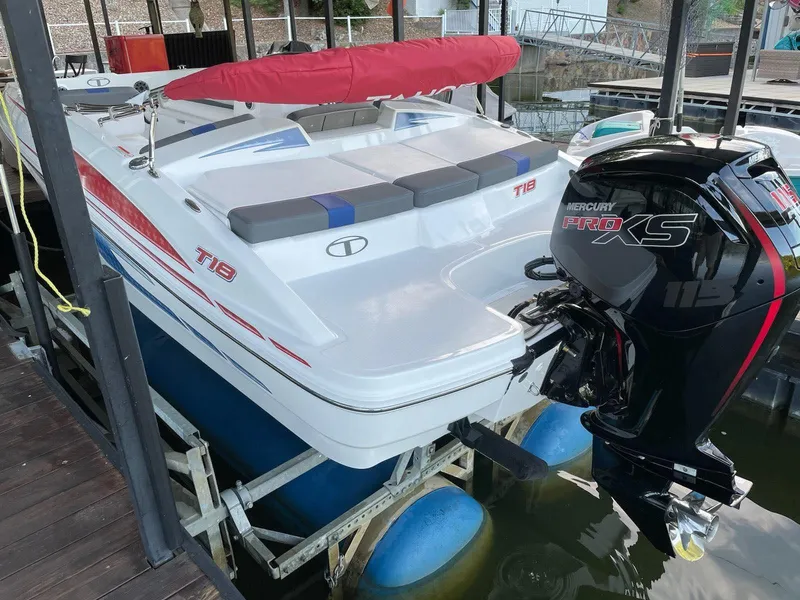 Slide: The Image of 2024 Tahoe T18 boat with Mercury Pro XS engine docked at marina. - 4