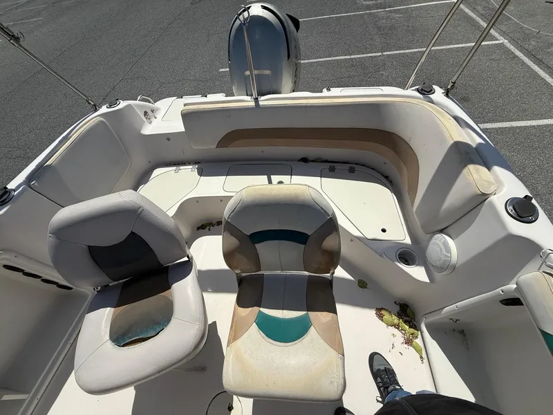 Slide: The Image of 2002 Hurricane Fun Deck GS211 boat interior with seating and storage compartments. - 8