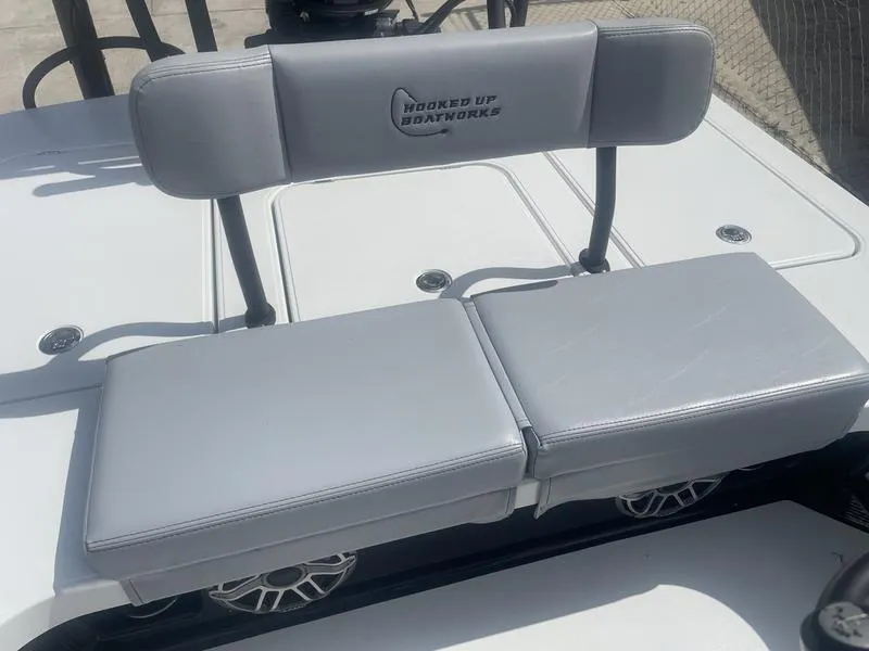Slide: The Image of 2024 Islamorada Boatworks Morada 18 seat with "Hooked Up Boatworks" logo. - 7