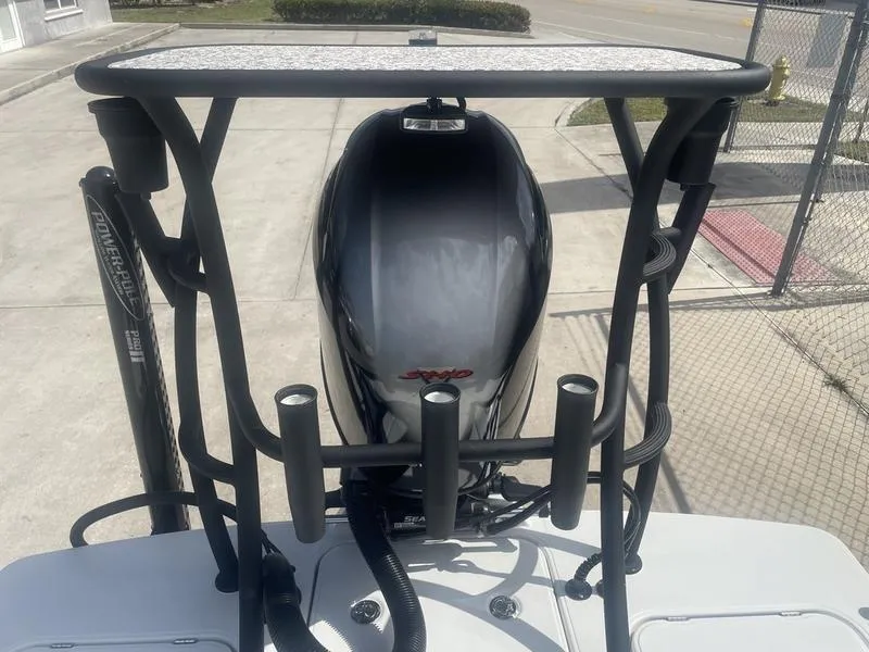 Slide: The Image of 2024 Islamorada Boatworks Morada 18 with powerful outboard motor, viewed from above. - 8