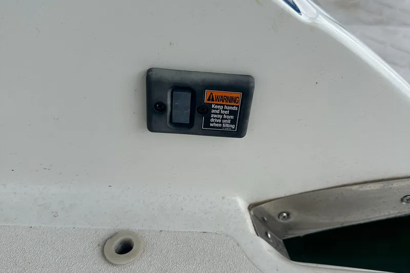 Slide: The Image of Switch panel with warning label on 2002 Cobalt 246 boat. - 24