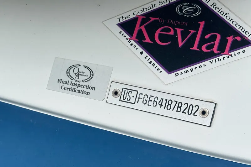 Slide: The Image of 2002 Cobalt 246 boat with Kevlar reinforcement and final inspection certification. - 34