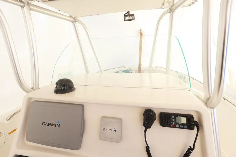 Slide: The Image of 2009 Sailfish 2660 boat console with Garmin navigation equipment and radio. - 10
