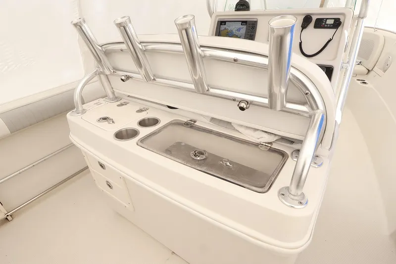 Slide: The Image of 2009 Sailfish 2660 boat console with rod holders and control panel. - 12