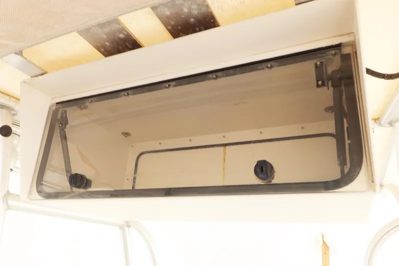 Slide: The Image of 2009 Sailfish 2660 boat storage compartment with transparent cover. - 20