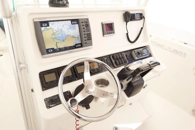 Slide: The Image of 2009 Sailfish 2660 boat dashboard with navigation equipment and steering wheel. - 7