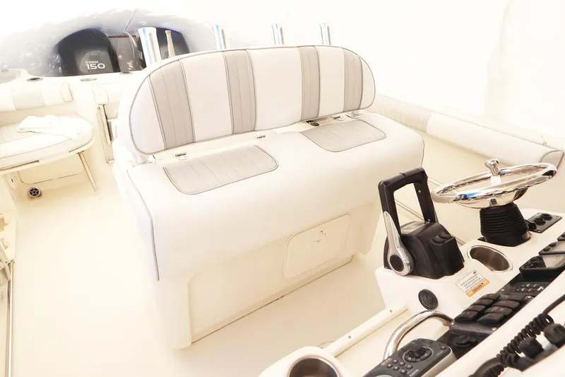Slide: The Image of 2009 Sailfish 2660 boat interior with seating and control panel. - 9