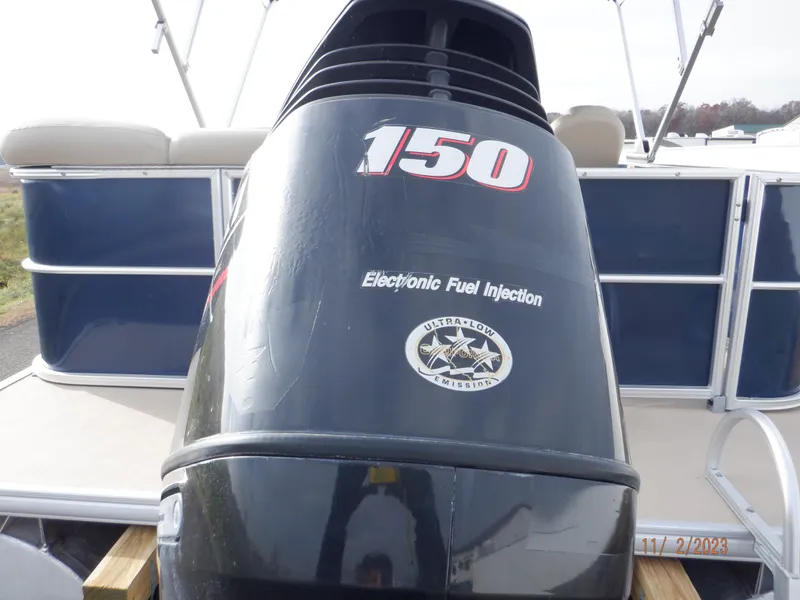 Slide: The Image of 2013 Sylvan Signature 8523 LZ boat with 150 HP electronic fuel injection engine. - 14