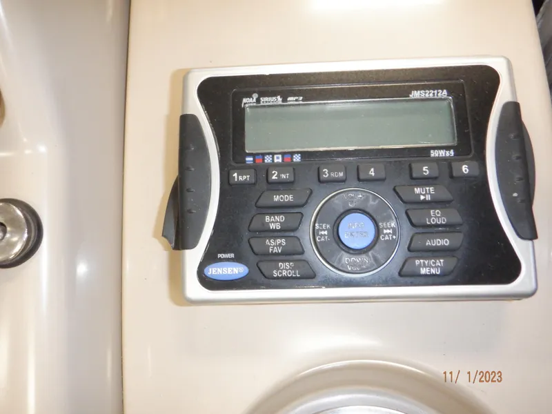 Slide: The Image of Jensen audio control panel on 2013 Sylvan Signature 8523 LZ boat. - 24