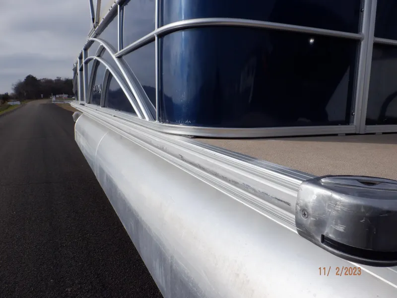 Slide: The Image of 2013 Sylvan Signature 8523 LZ pontoon boat on a road, side view. - 38