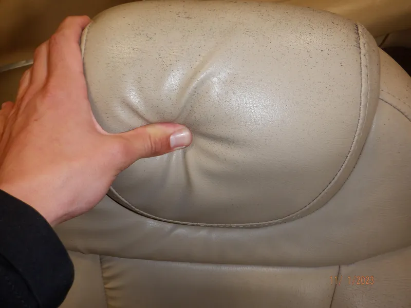 Slide: The Image of Hand pressing beige leather seat of 2013 Sylvan Signature 8523 LZ. - 39