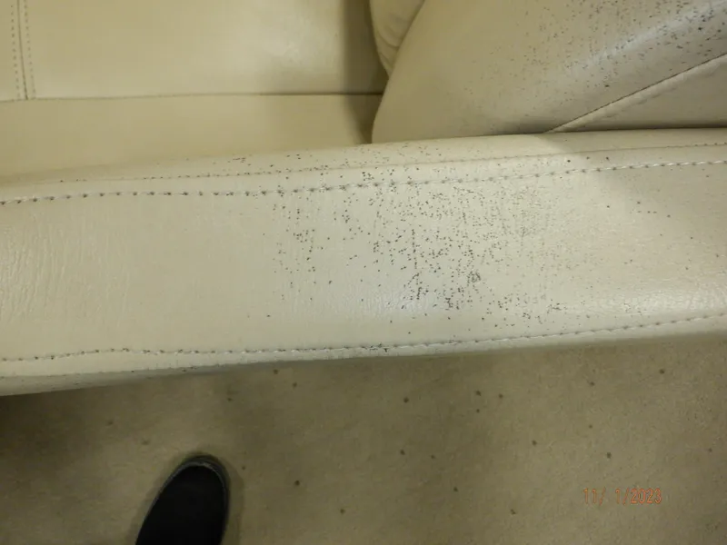 Slide: The Image of Close-up of worn white leather seat on 2013 Sylvan Signature 8523 LZ. - 40