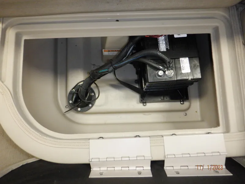 Slide: The Image of Battery compartment of 2013 Sylvan Signature 8523 LZ boat, featuring secure wiring and connections. - 45