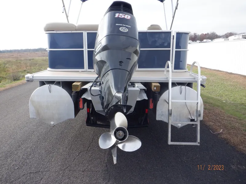 Slide: The Image of 2013 Sylvan Signature 8523 LZ pontoon boat with 150 HP outboard motor, rear view. - 5