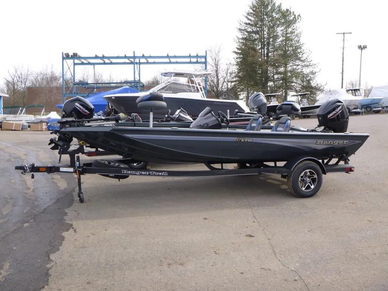 The Image of 2024 Ranger RT178 boat on trailer, parked outdoors, side view. - 0