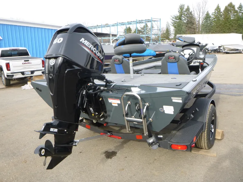 Slide: The Image of 2024 Ranger RT178 boat with Mercury 50 engine, parked outdoors. - 11