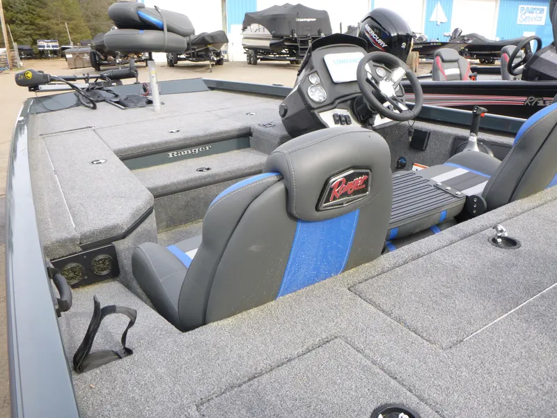 Slide: The Image of 2024 Ranger RT178 boat interior with steering wheel and seating. - 8
