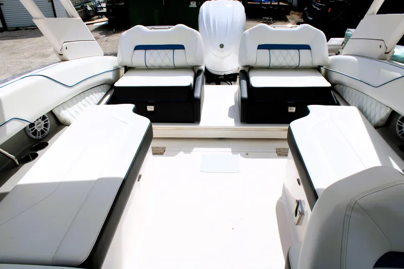 Slide: The Image of 2023 Regal LX6 boat interior with luxurious white seating and modern design. - 21