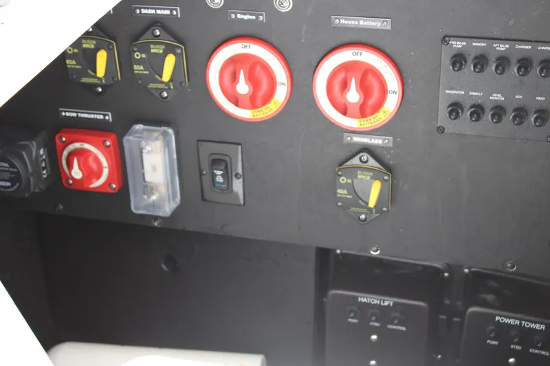 Slide: The Image of Control panel of 2023 Regal LX6 boat with switches and dials. - 22