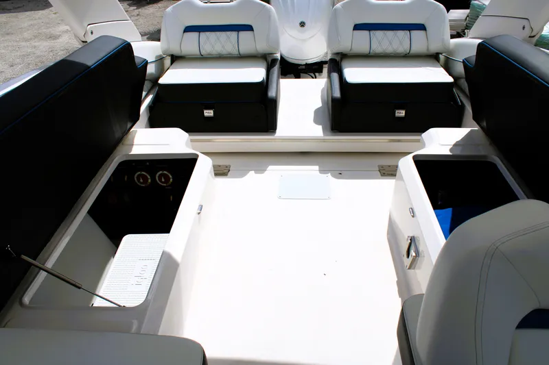 Slide: The Image of 2023 Regal LX6 boat interior with spacious seating and storage compartments. - 24