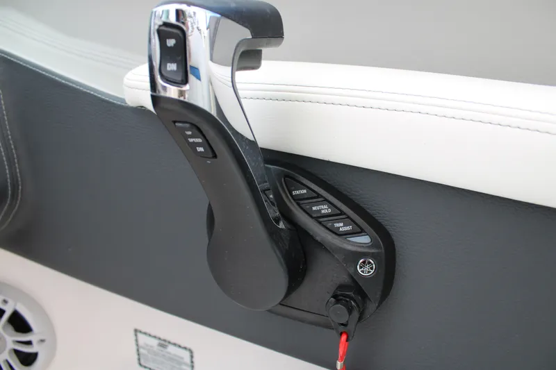 Slide: The Image of 2023 Regal LX6 boat throttle control with sleek design and ergonomic handle. - 30