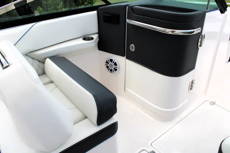 Slide: The Image of 2023 Regal LX6 boat interior with sleek black and white seating and modern design. - 35