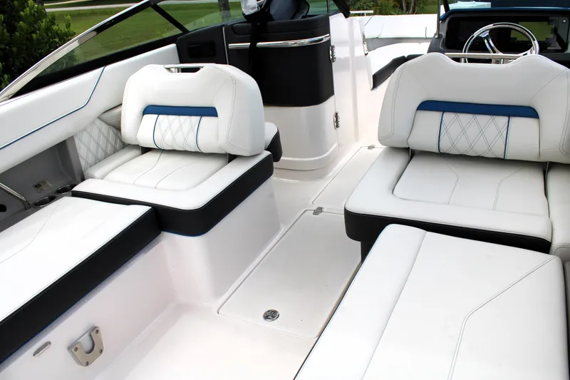 Slide: The Image of Luxurious interior of 2023 Regal LX6 boat with white leather seating. - 36