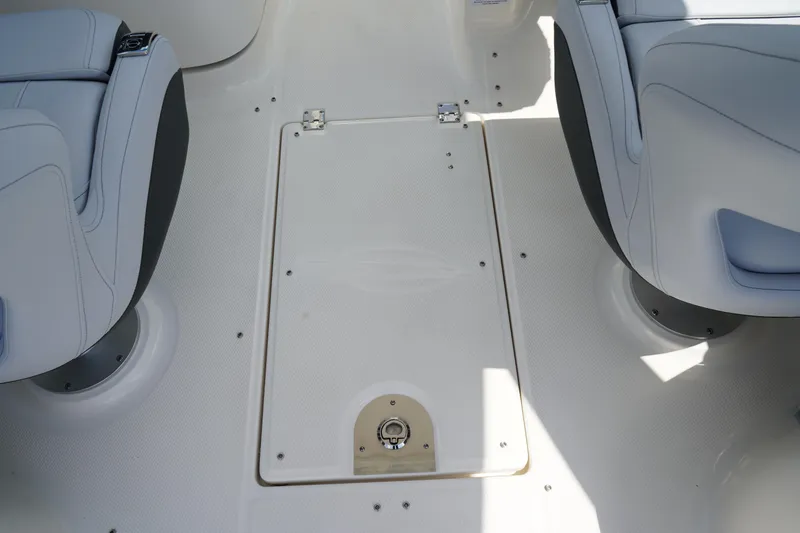 Slide: The Image of 2025 Chaparral 270 OSX boat interior with seating and storage compartment. - 12