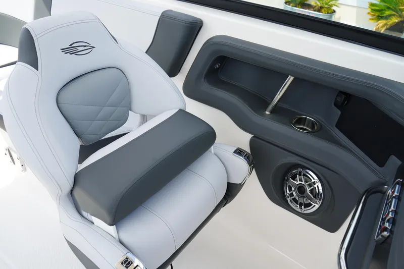 Slide: The Image of 2025 Chaparral 270 OSX boat interior with luxury seating and modern speaker system. - 15
