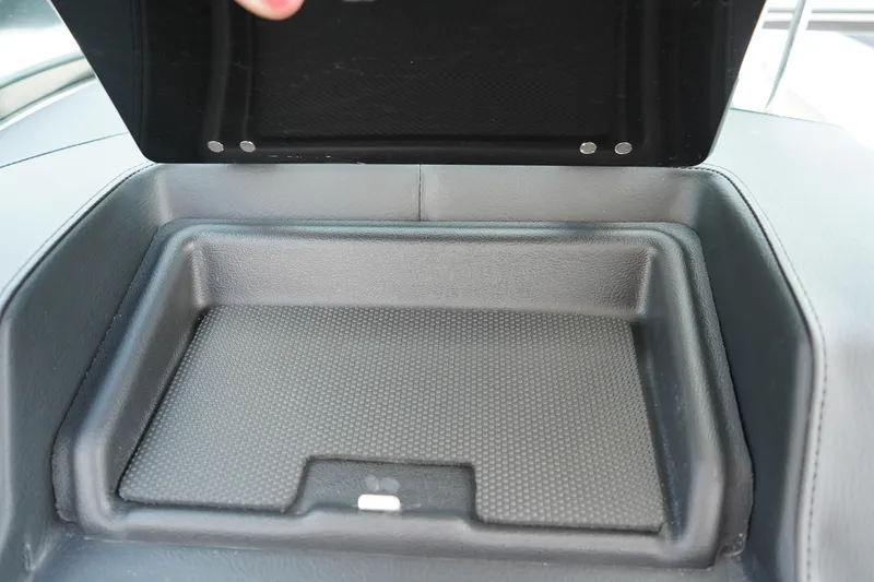 Slide: The Image of Storage compartment in 2025 Chaparral 270 OSX boat, open lid view. - 19