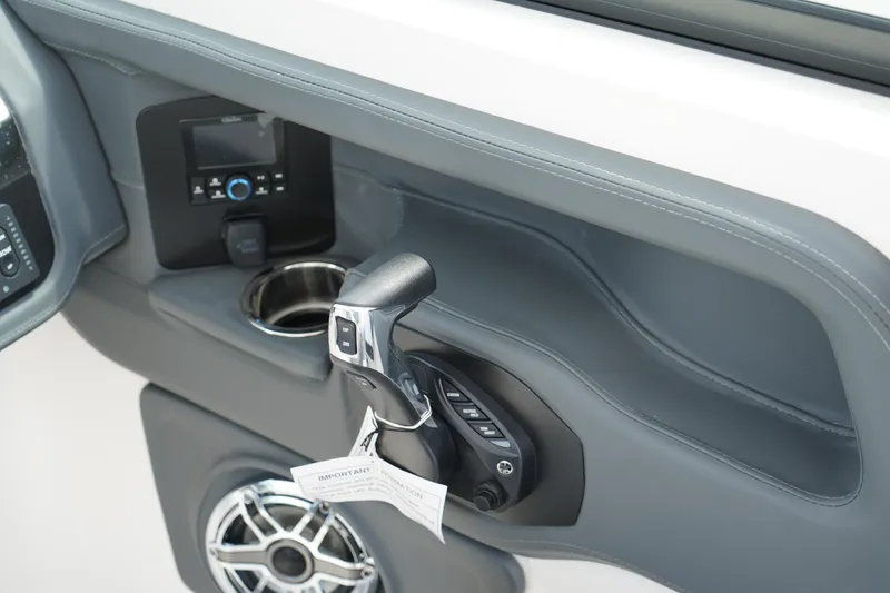Slide: The Image of Control panel of 2025 Chaparral 270 OSX boat with throttle and speaker. - 28