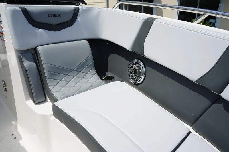 Slide: The Image of 2025 Chaparral 270 OSX boat interior with stylish seating and speaker detail. - 35
