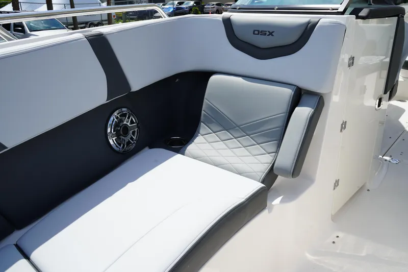 Slide: The Image of 2025 Chaparral 270 OSX boat interior with gray seating and speaker. - 36
