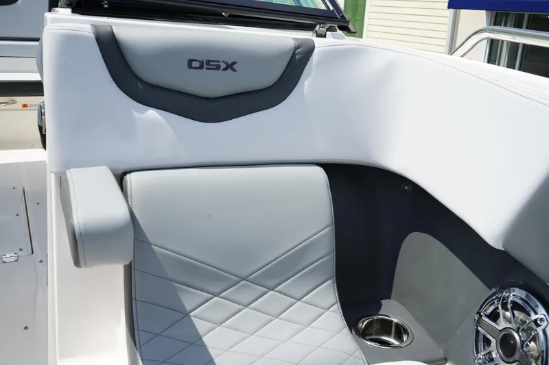 Slide: The Image of 2025 Chaparral 270 OSX boat interior with gray seating and cup holder. - 37