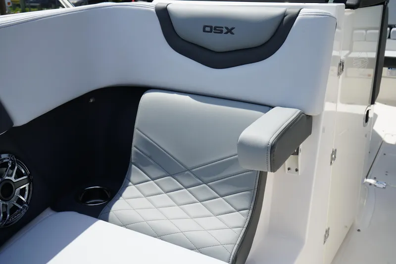 Slide: The Image of 2025 Chaparral 270 OSX boat interior with stylish gray seating and armrest. - 38