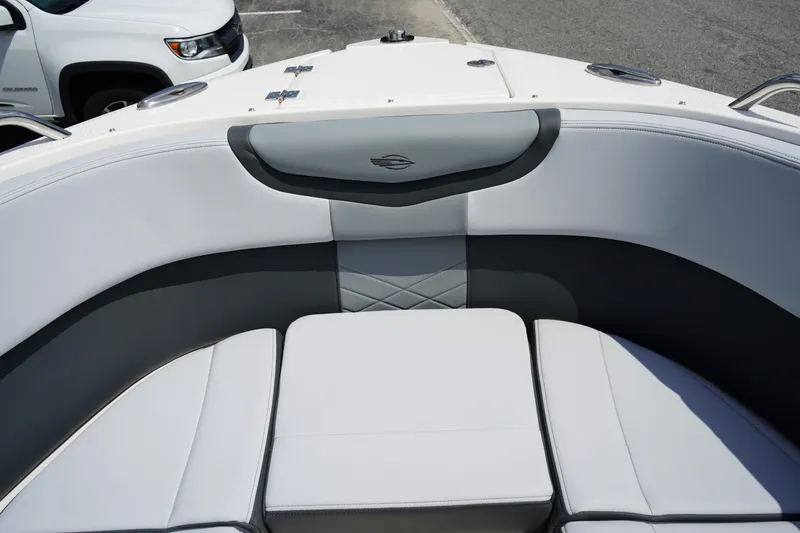 Slide: The Image of 2025 Chaparral 270 OSX boat interior with cushioned seating and sleek design. - 40