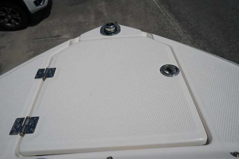 Slide: The Image of 2025 Chaparral 270 OSX boat deck with hatch and hardware. - 41