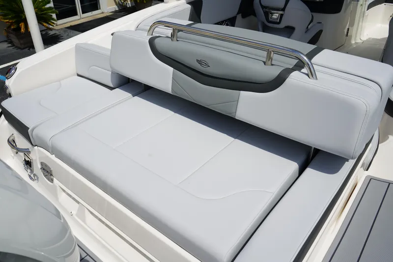 Slide: The Image of 2025 Chaparral 270 OSX boat interior with luxurious seating and modern design. - 7