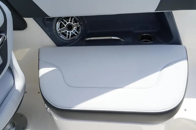 Slide: The Image of 2025 Chaparral 270 OSX boat interior with speaker and seating area. - 9